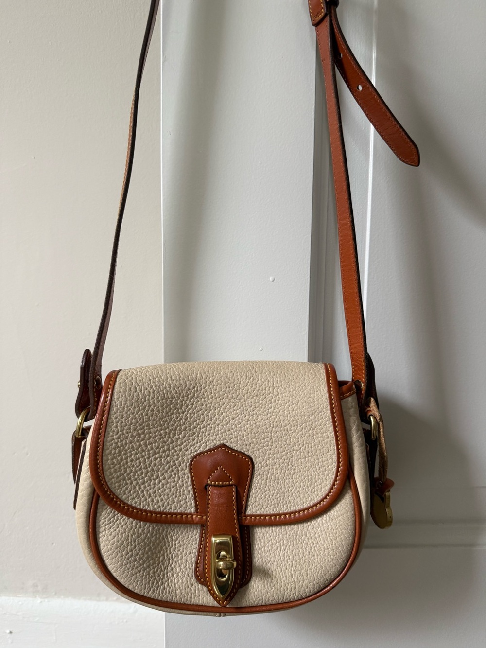 VINTAGE Dooney & Bourke All-Weather Leather Arrowhead Flap Saddle Bag
